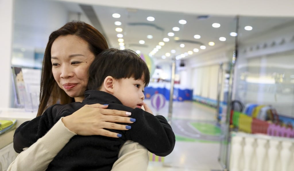 Principal Yannie Chau gets a hug from a pupil. Photo: May Tse