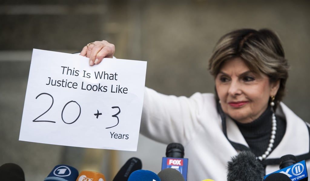 Lawyer Gloria Allred holds up a sign showing the sentence given to Harvey Weinstein before speaking to the media outside court in New York on Wednesday. Photo: Bloomberg
