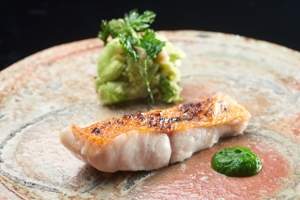 Charcoal-grilled ‘Kinmedai’ alfonsino with watercress purée and vegetables.
