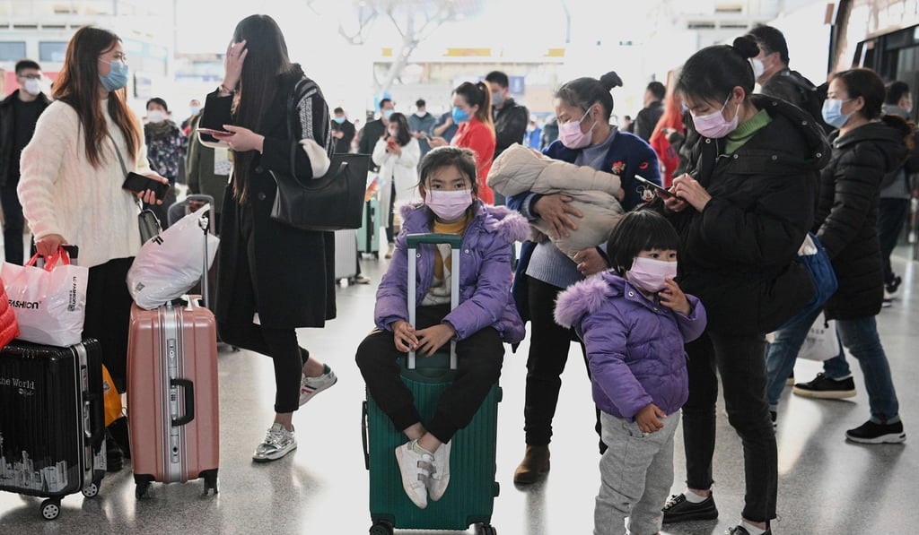 Passengers wearing face masks wait for their trains at Changsha railway station in China’s central Hunan province. Photo: AFP Passengers wearing face masks wait for their trains at Changsha railway station in China’s central Hunan province. Photo: AFP