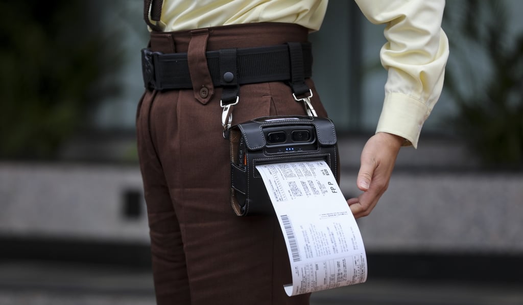 Traffic wardens will have portable printers for the “e-tickets”. Photo: Winson Wong Traffic wardens will have portable printers for the “e-tickets”. Photo: Winson Wong