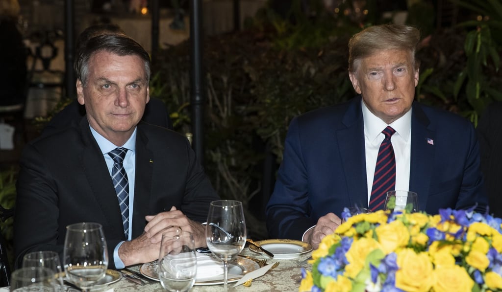 Brazilian President Jair Bolsonaro and President Donald Trump at Mar-a-Lago in Palm Beach, Florida on Saturday. Photo: AP Brazilian President Jair Bolsonaro and President Donald Trump at Mar-a-Lago in Palm Beach, Florida on Saturday. Photo: AP