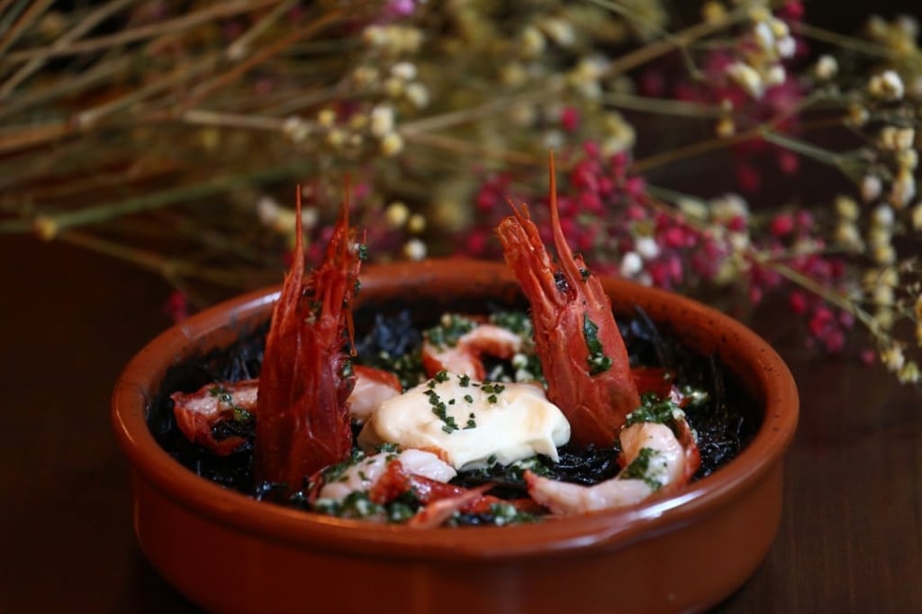 Black fideos with Spanish red king prawns. Photo: Jonathan Wong
