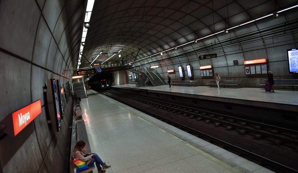 Passengers wait in an empty subway station, in Bilbao, northern Spain. Photo: AP