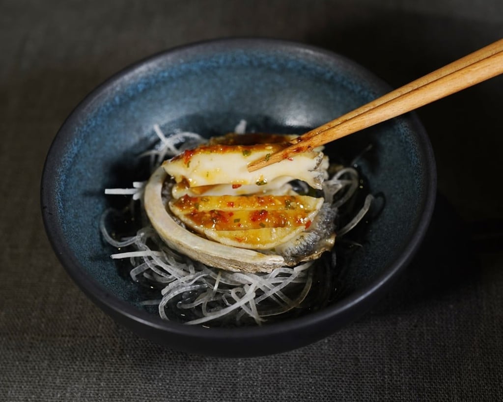 Cold abalone in smoke with plum sauce. Cold abalone in smoke with plum sauce.