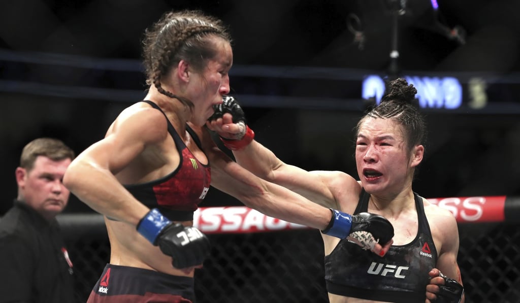 UFC women's strawweight champion Zhang Weili punches former champion Joanna Jedrzejczyk at UFC 248. Photo: AP