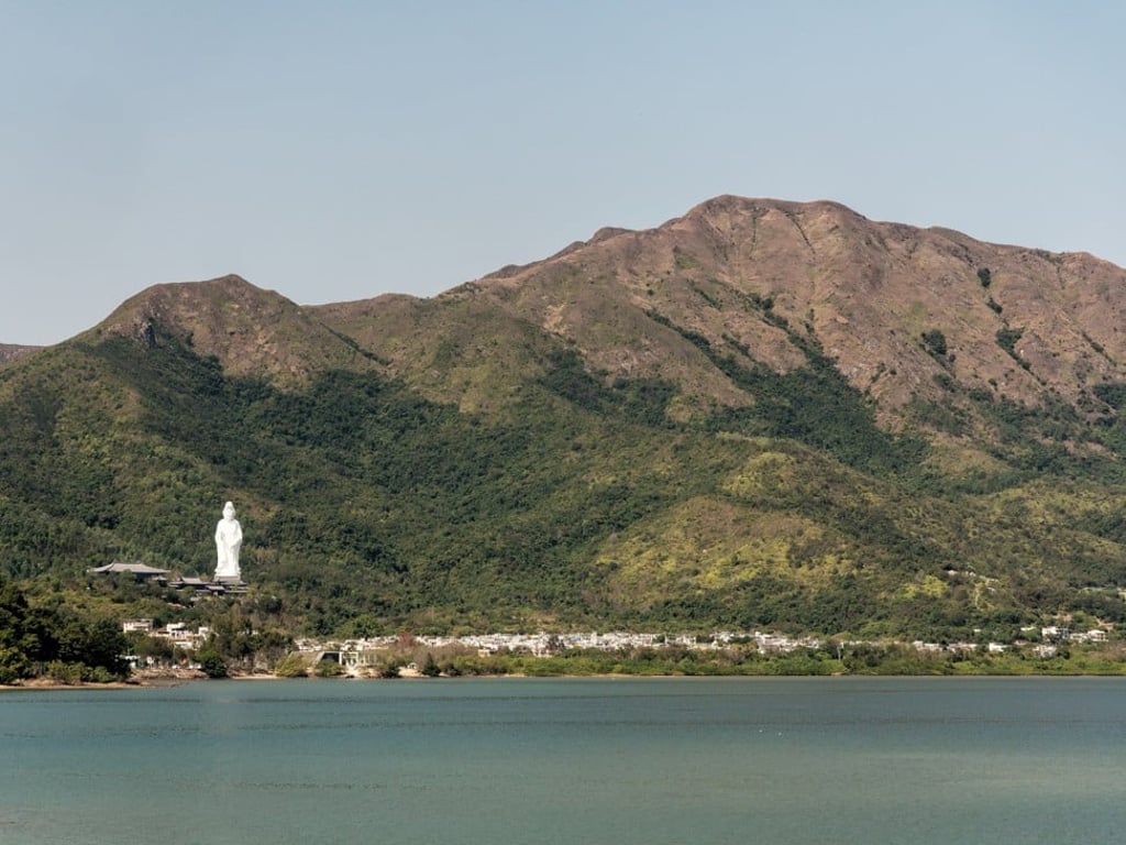 The Guan Yin statue and Pat Sin Leng mountain range can be seen along the bike route from Tai Po Market to Tai Mei Tuk. Photo: Martin Williams