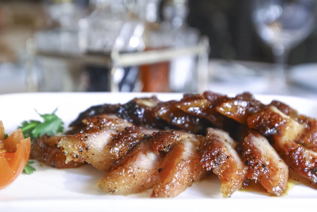 A signature dish at China Tang is barbecued pork.