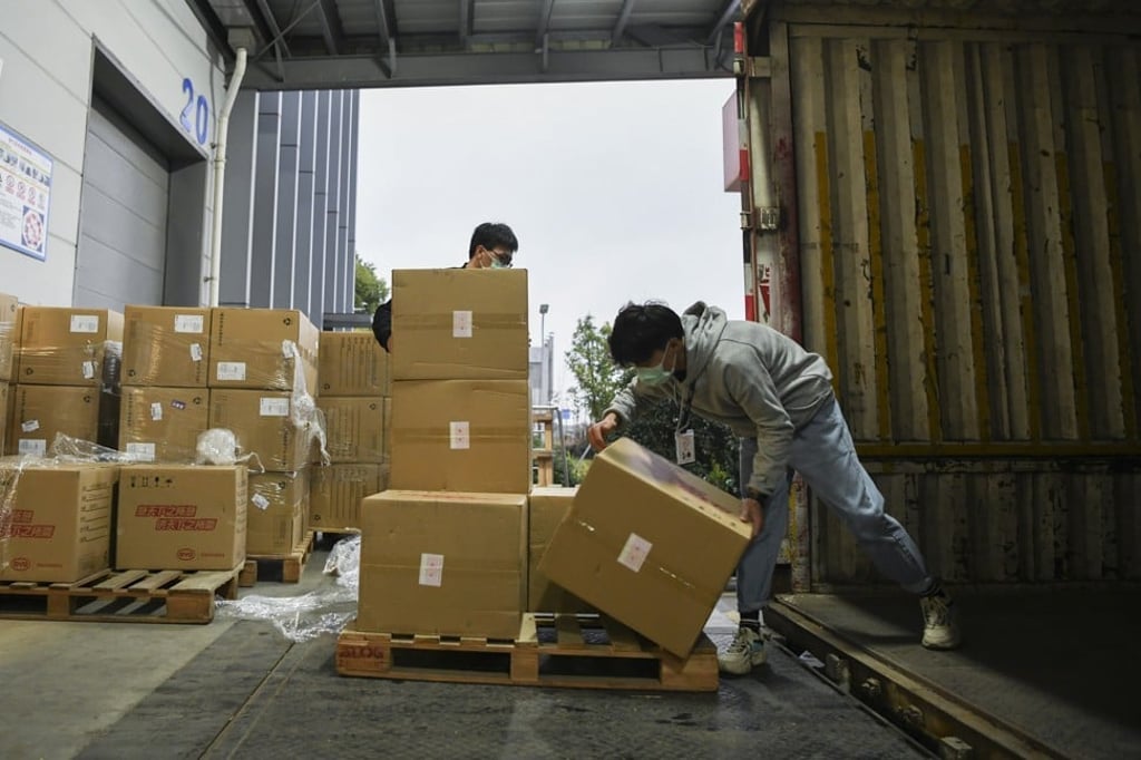Workers in China load donated medical supplies bound for the United States. Photo: Handout Workers in China load donated medical supplies bound for the United States. Photo: Handout