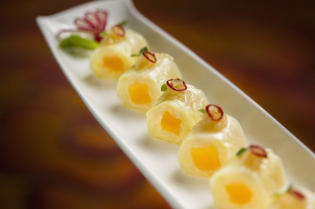 Sweet and sour cabbage roll with mango in chilli vinaigrette.