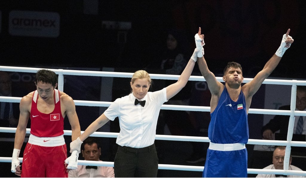 Iran’s Daniyal Shabakhsh raises his arms in triumph after defeating Hong Kong’s Rex Tso in Amman. Photo: EPA