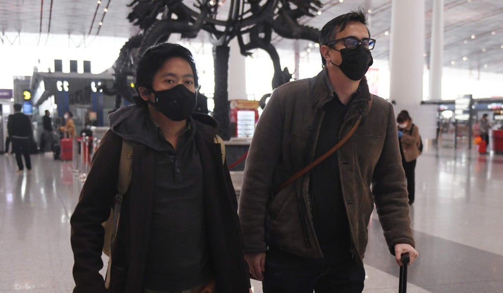Wall Street Journal reporters Philip Wen (left) and Josh Chin walk through Beijing Capital Airport after being expelled from China on February 24. Photo: AFP Wall Street Journal reporters Philip Wen (left) and Josh Chin walk through Beijing Capital Airport after being expelled from China on February 24. Photo: AFP