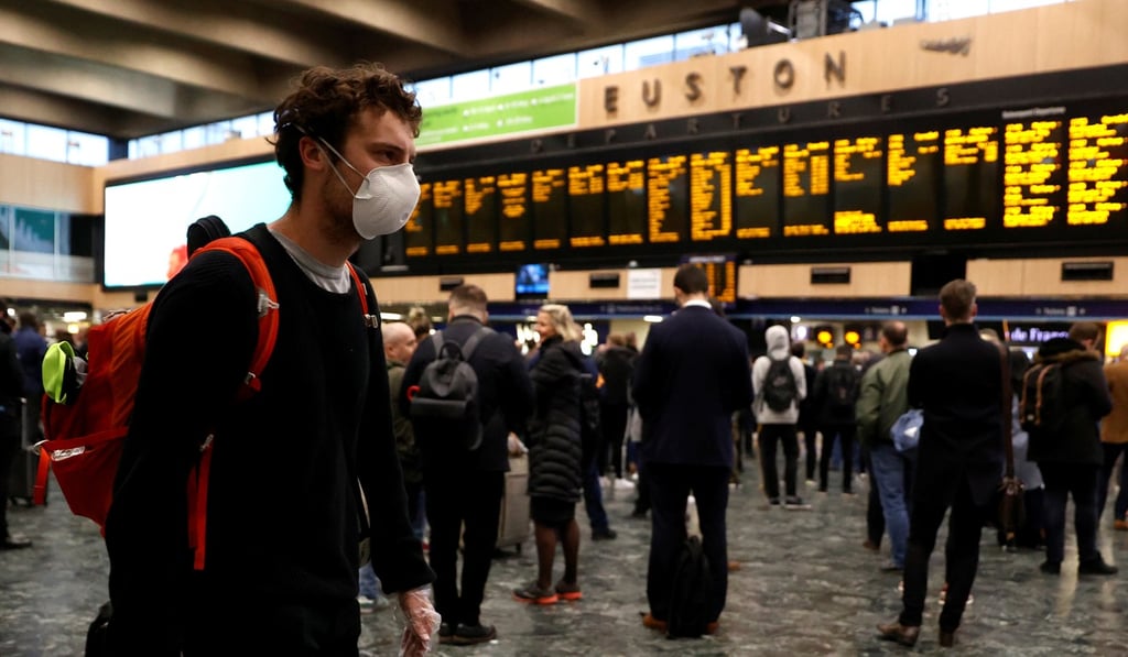 A man wearing a face mask at London Euston Station, Britain, during rush hour on Tuesday. Photo: Reuters A man wearing a face mask at London Euston Station, Britain, during rush hour on Tuesday. Photo: Reuters