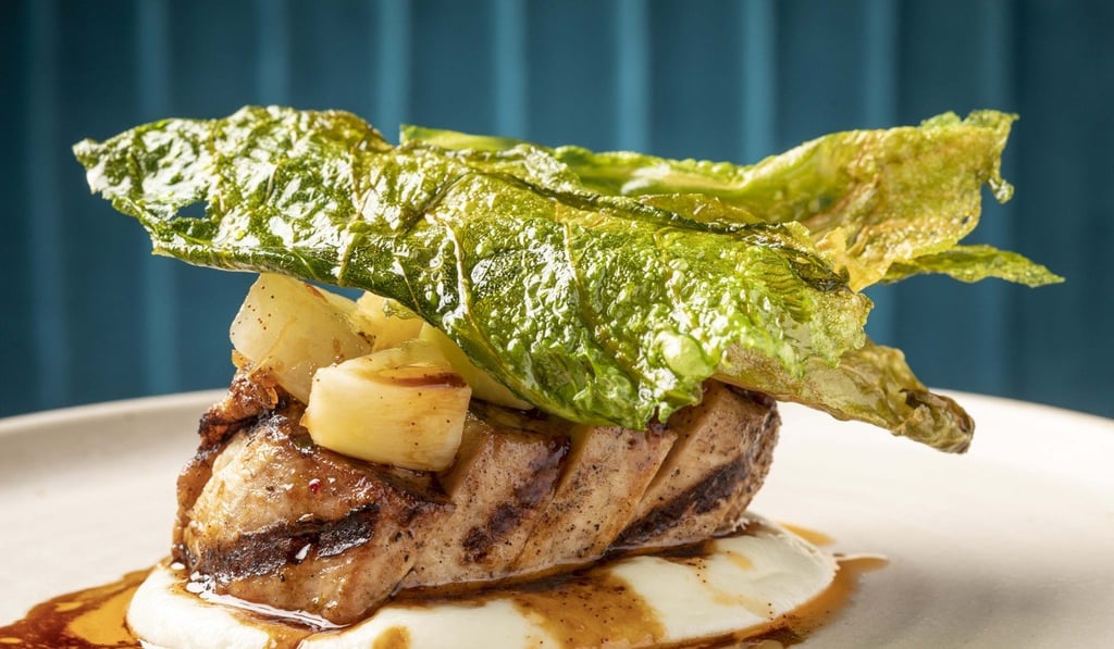 Pork loin, cauliflower purée, XO, pickled kohlrabi and cabbage crisps at Hue. Photo: handout