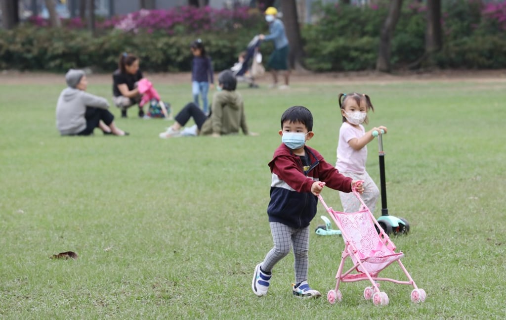 Children in masks at Victoria Park. Photo: Dickson Lee