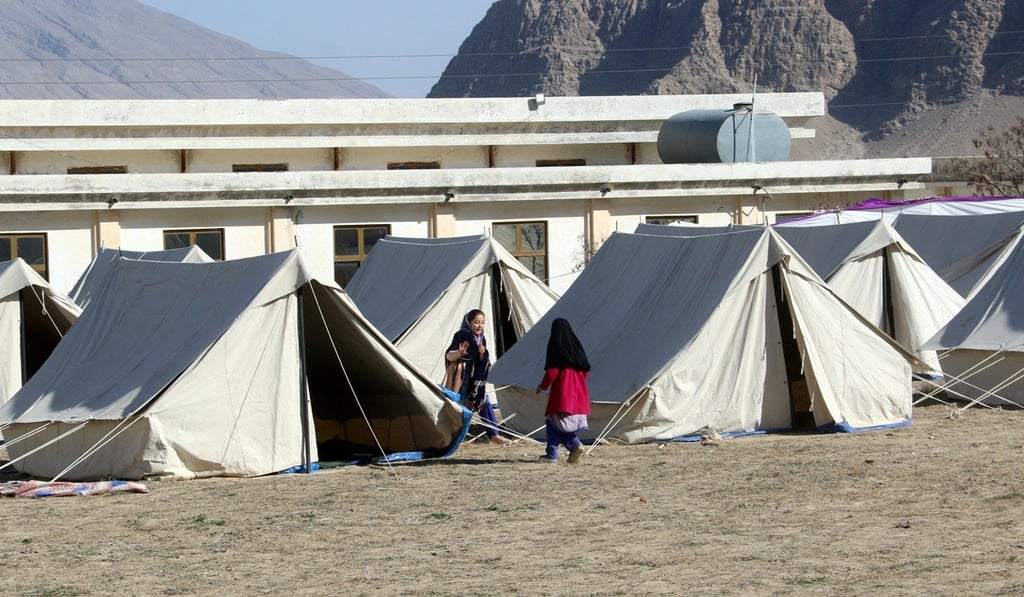 Children play around tents in Pakistan set up to quarantine people who crossed from Iran’s border post Taftan. Photo: Reuters Children play around tents in Pakistan set up to quarantine people who crossed from Iran’s border post Taftan. Photo: Reuters