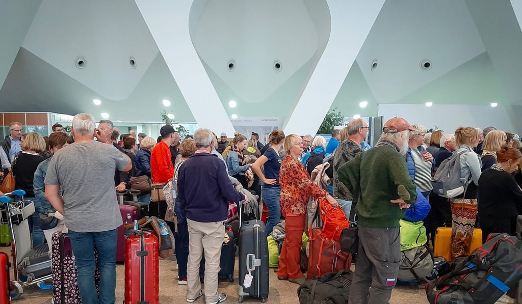 Passengers wait for their flights at Morocco’s Marrakesh Airport after the country decided to allow a group of ‘exceptional flights’ to repatriate tourists after announcing a ban on all inbound and outbound flights. Photo: AFP