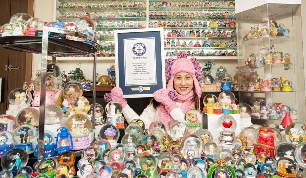 Wendy Suen in front of a selection of her snow globe collection in Shanghai, China. Photo: Guinness World Records
