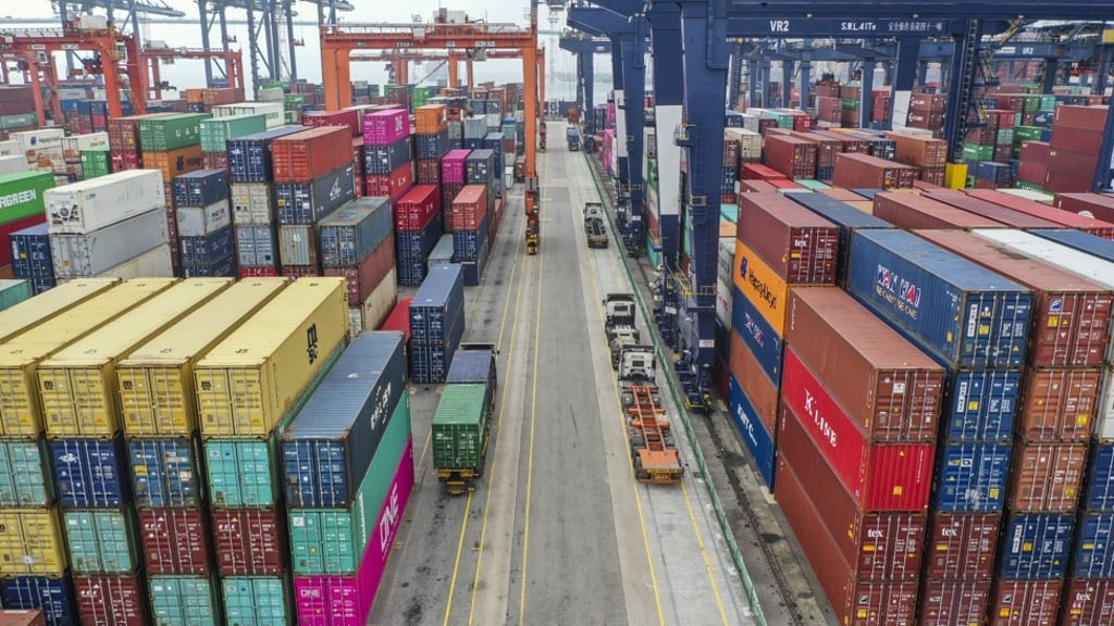 Trucks between stacks of shipping containers at the Hong Kong Container Terminal, situated in the Kwai Chung-Tsing Yi basin, on 17 May 2019. Photo: Roy Issa