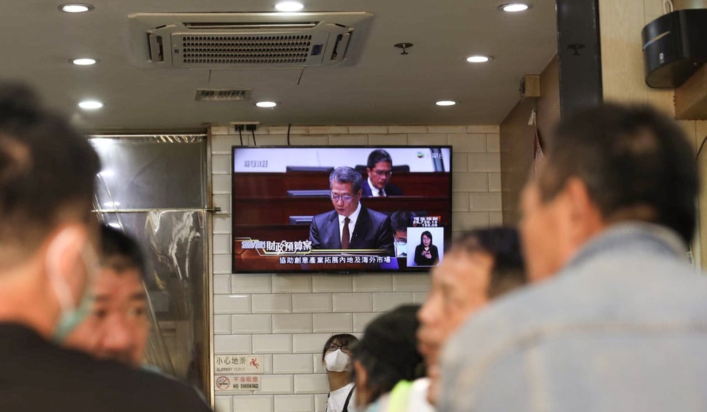 People eat in a restaurant as Financial Secretary Paul Chan Mo-po delivers his 2020-2021 budget at the Legislative Council on February 26, announcing a slew of measures to help struggling small businesses. Photo: Xiaomei Chen