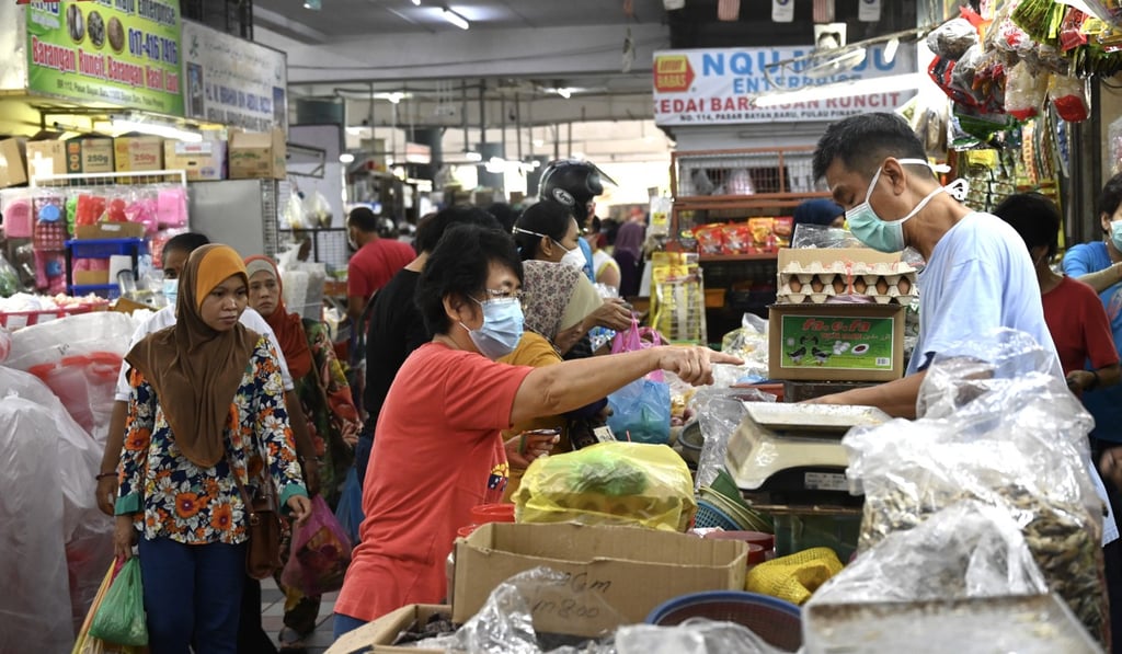 Shoppers at a market on the third day of a partial lockdown in Malaysia. Photo: AFP Shoppers at a market on the third day of a partial lockdown in Malaysia. Photo: AFP