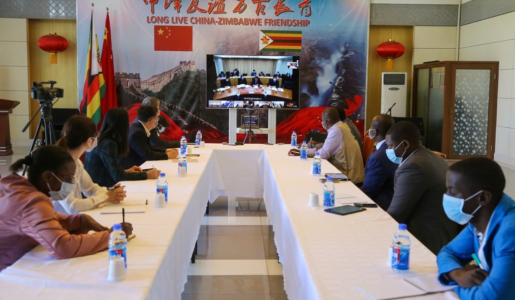 Government and health officials from Zimbabwe take part in a videoconference on the Covid-19 pandemic with experts from China. Photo: Xinhua