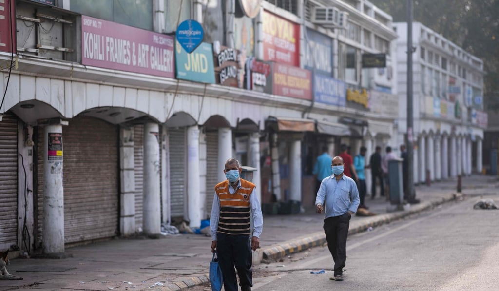 Closed shops in a market area in New Delhi. Photo: AFP