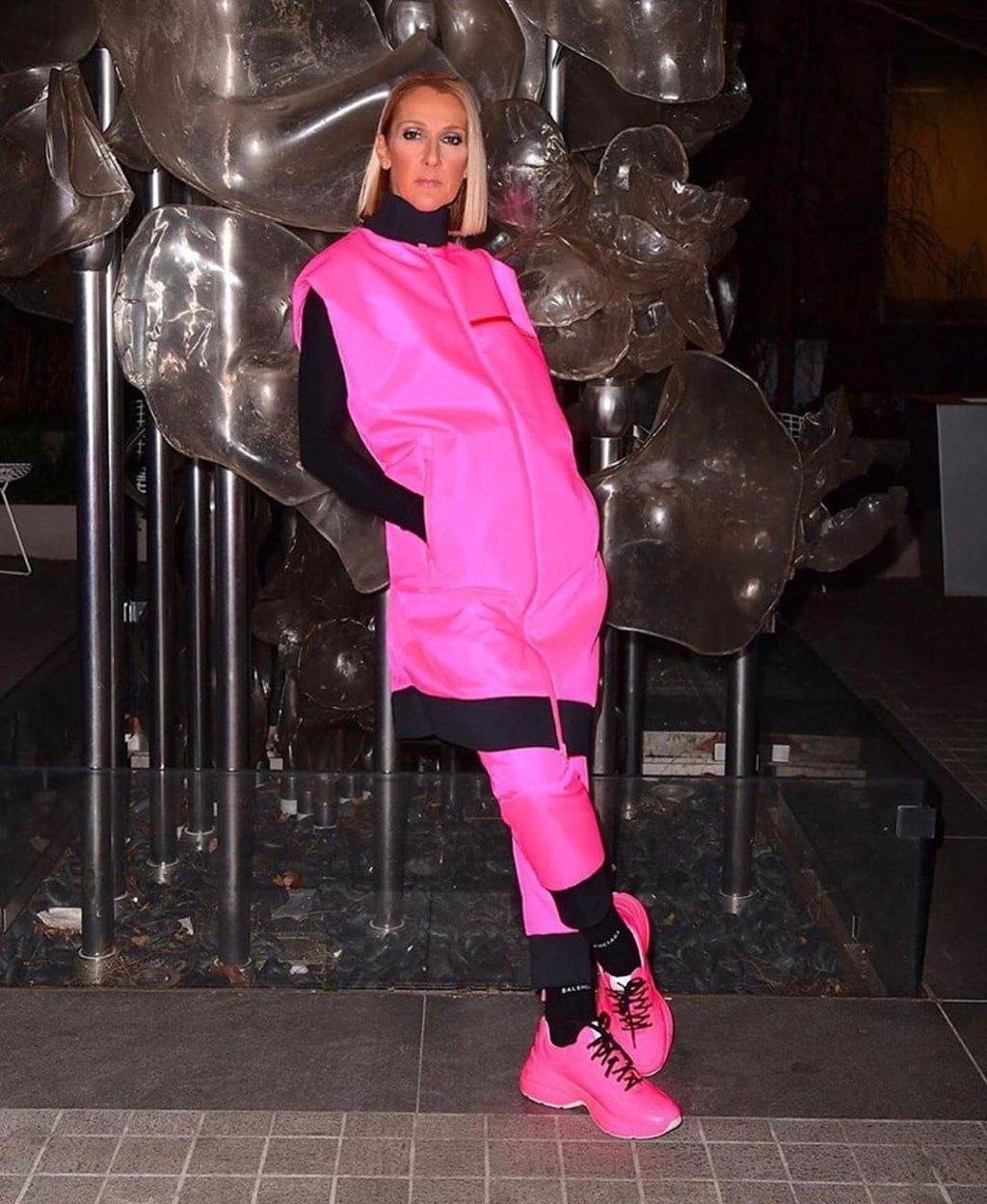 Celine Dion in Prada technical fabric vest and padded technical fabric trousers, Wolford ‘Colorado’ bodysuit, and Gucci ‘Rhyton’ leather sneakers. Photo: @queen_celinedion/Instagram