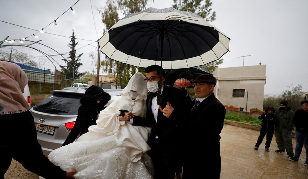 Imad Sharaf accompanies his bride Baraa Amarneh on their wedding day in Hebron, in the Israeli-occupied West Bank. Photo: Reuters Imad Sharaf accompanies his bride Baraa Amarneh on their wedding day in Hebron, in the Israeli-occupied West Bank. Photo: Reuters