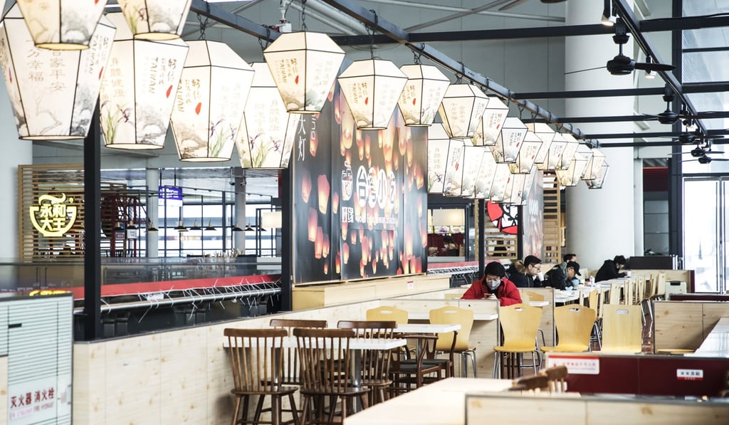 A few travellers dine in a restaurant at Hongqiao Railway Station in Shanghai on March 10. Restaurants and catering services, which account for roughly 10 per cent of China’s retail sales, saw revenue plunge by 43 per cent year on year in January and February. Photo: Bloomberg