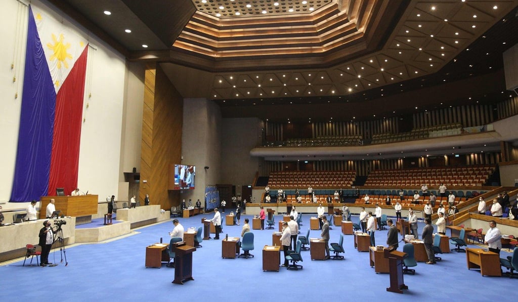 Members of the Philippine Lower House of Congress attend a special session, with desks arranged to observe social distancing, to discuss proposed emergency powers to be given to President Rodrigo Duterte. Photo: AFP
