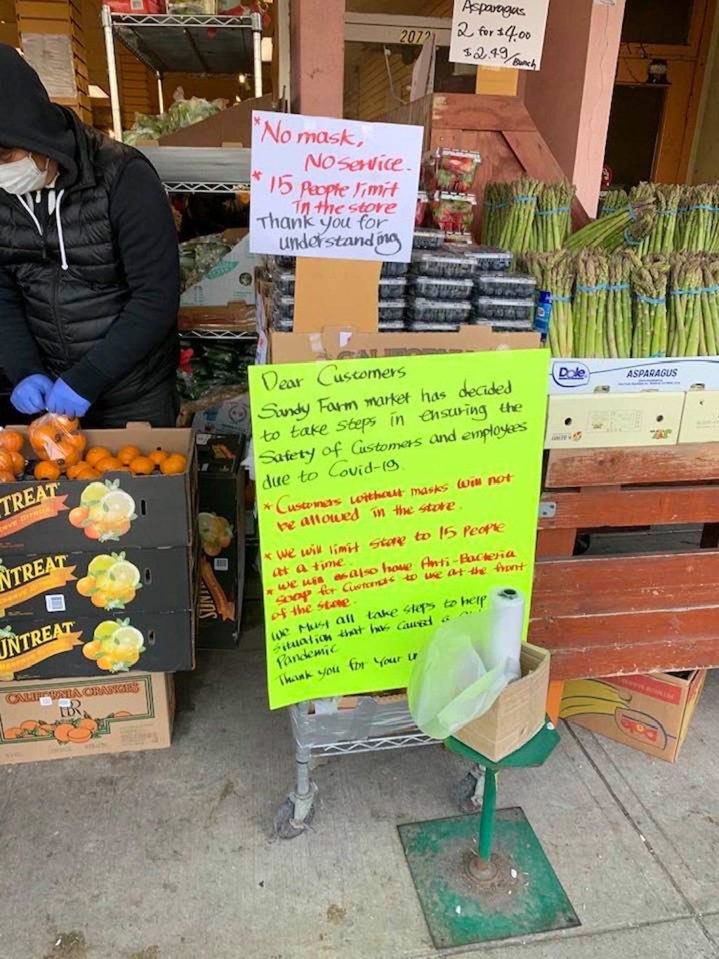 Signs explain the “no mask, no service” policy of Vancouver's Sandy Farm Market grocery store in the neighbourhood of Kerrisdale. Photo: Caroline Wang
