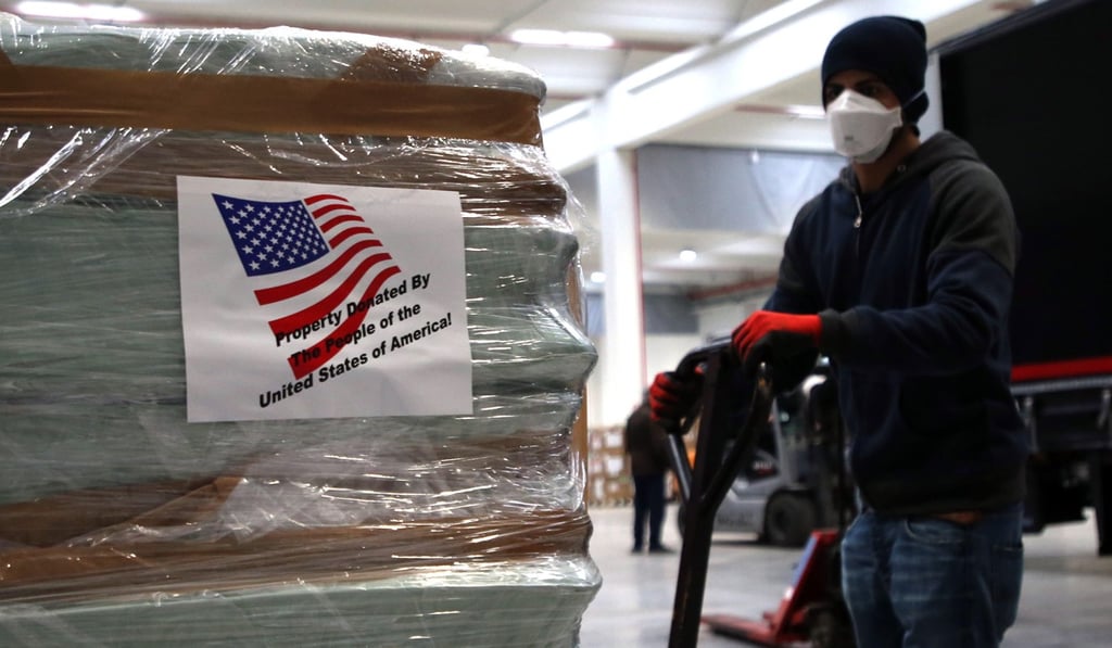 Supplies sent from the United States are unloaded in Milan. Photo: EPA-EFE