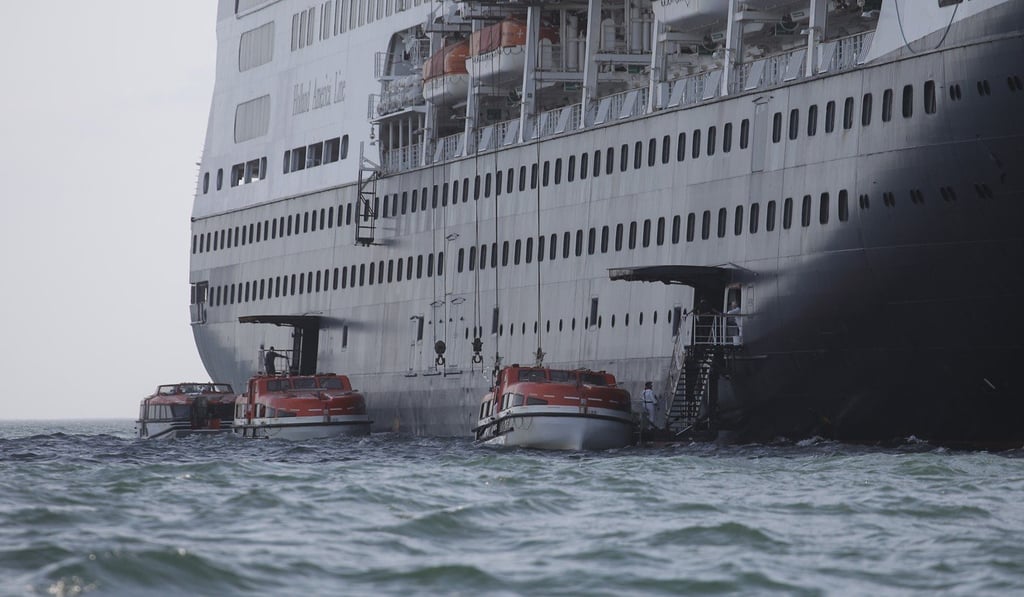 Passengers of the cruise ship MS Zaandam being transported by motorboat to the cruise ship MS Rotterdam at Panama City Bay. Photo: DPA Passengers of the cruise ship MS Zaandam being transported by motorboat to the cruise ship MS Rotterdam at Panama City Bay. Photo: DPA