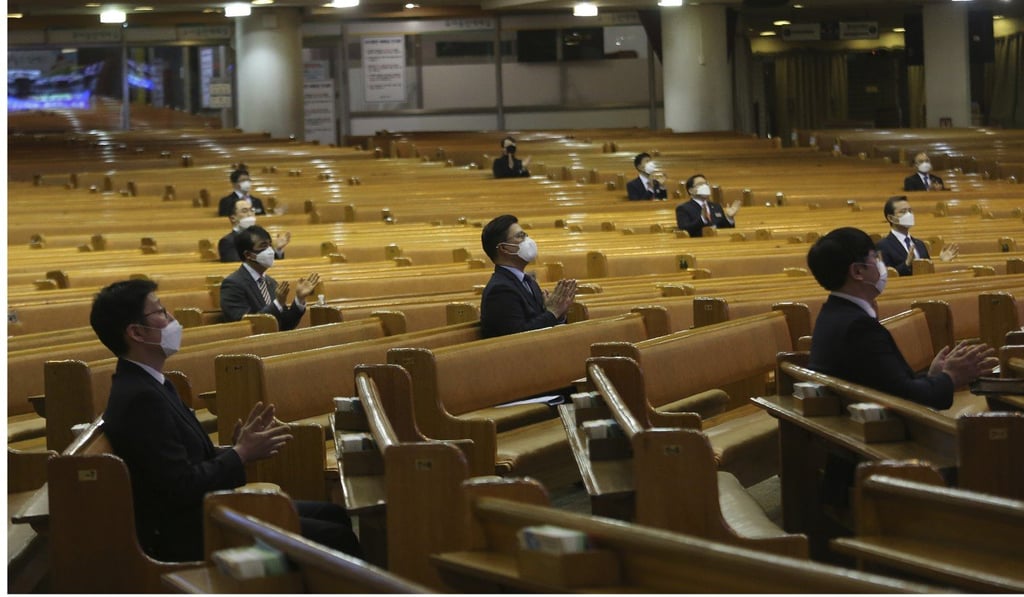 Pastors wearing face masks and sitting far apart attend a service at a church in Seoul. Photo: AP Pastors wearing face masks and sitting far apart attend a service at a church in Seoul. Photo: AP