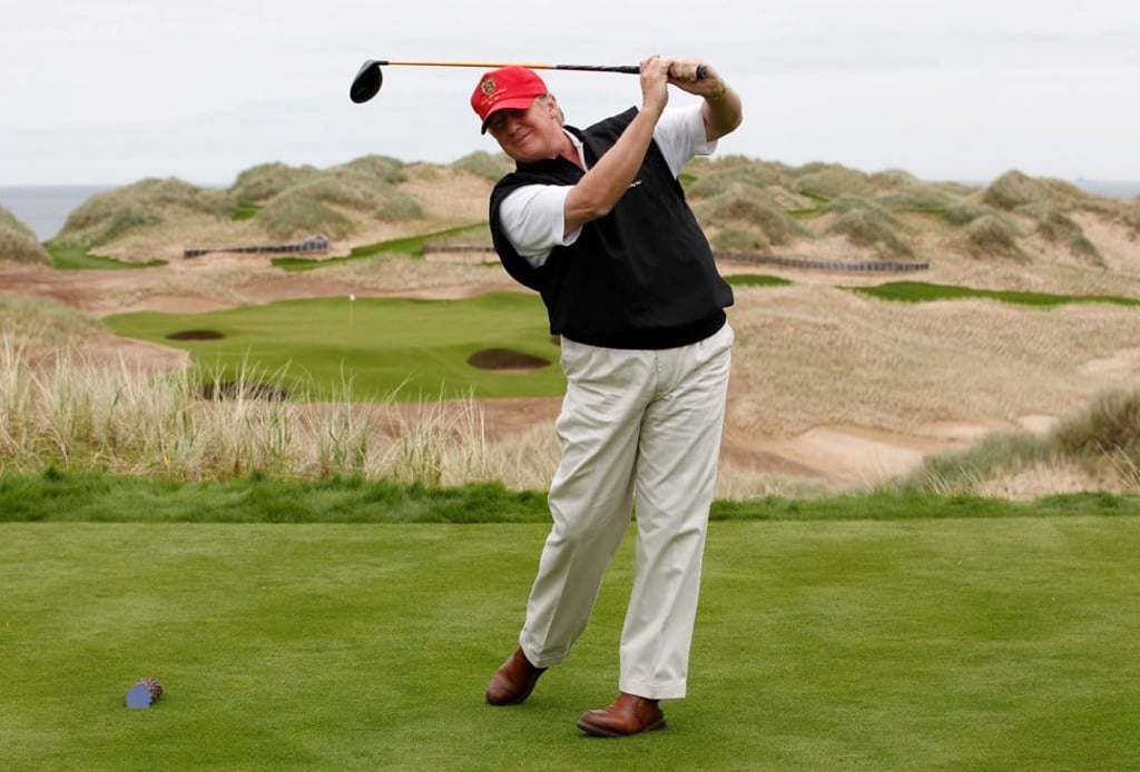 Trump practices his swing at the 13th tee of his new Trump International Golf Links course at the Menie Estate near Aberdeen, Scotland. Photo: Reuters
