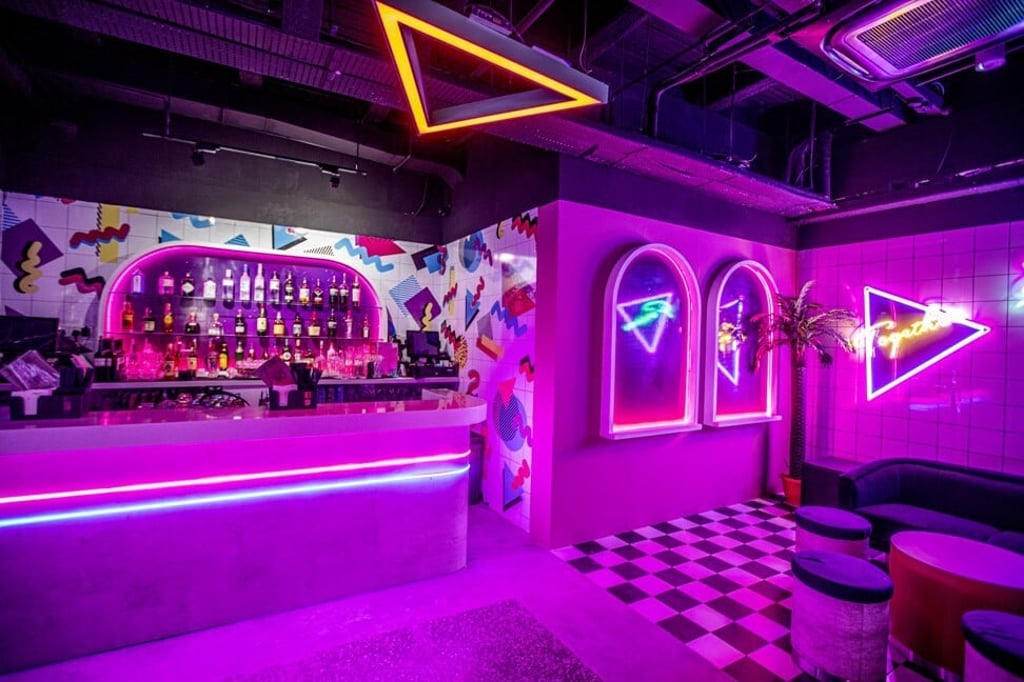 The neon-lit interior bar area of Nineteen80 in Singapore. Photo: Nineteen80