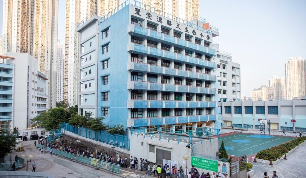 Voters queue around the block to vote on November 24 for the district council elections as turnout hit its highest level. Photo: Bloomberg