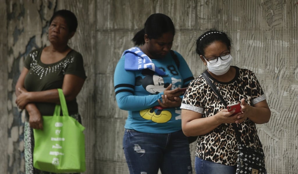 Women practice social distancing as they wait in line to enter a supermarket in Panama City. Photo: AP Photo Women practice social distancing as they wait in line to enter a supermarket in Panama City. Photo: AP Photo