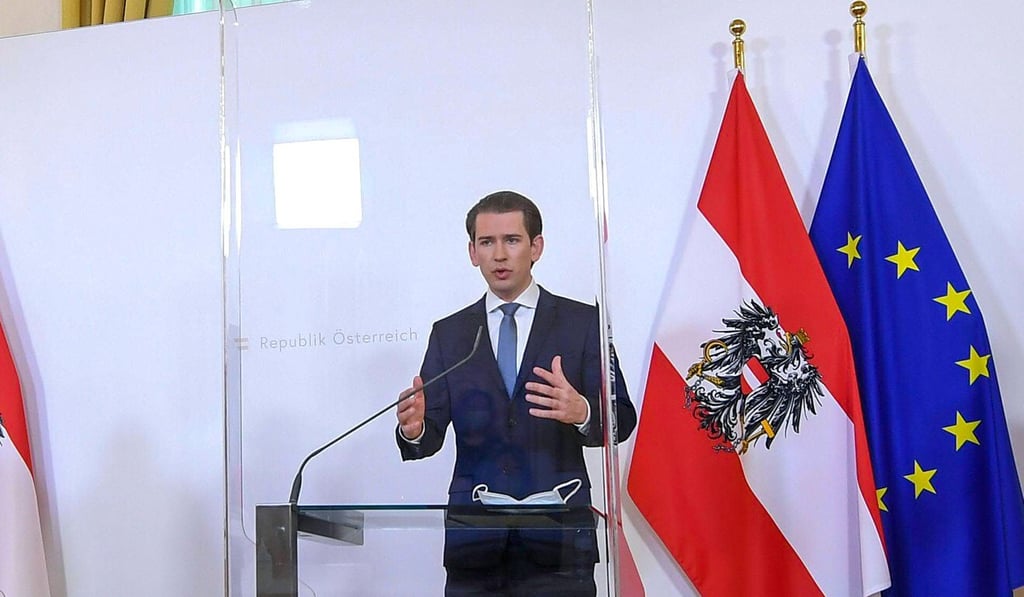 Austrian Chancellor Sebastian Kurz speaks from behind a protective glass barrier at press conference. Photo: DPA Austrian Chancellor Sebastian Kurz speaks from behind a protective glass barrier at press conference. Photo: DPA