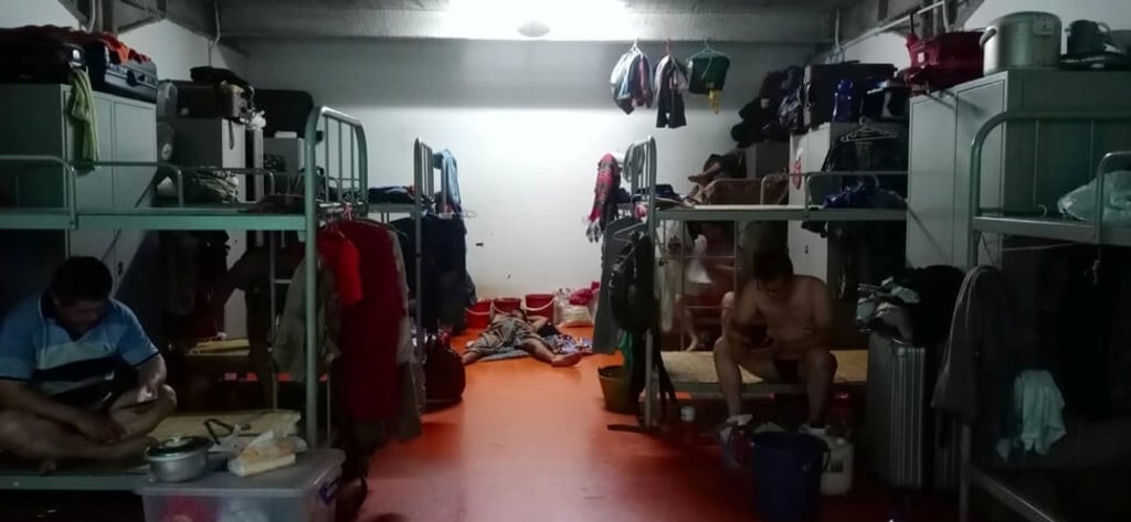 Workers in a dormitory where a quarantine is in effect. Photo: Obtained by Reuters Workers in a dormitory where a quarantine is in effect. Photo: Obtained by Reuters
