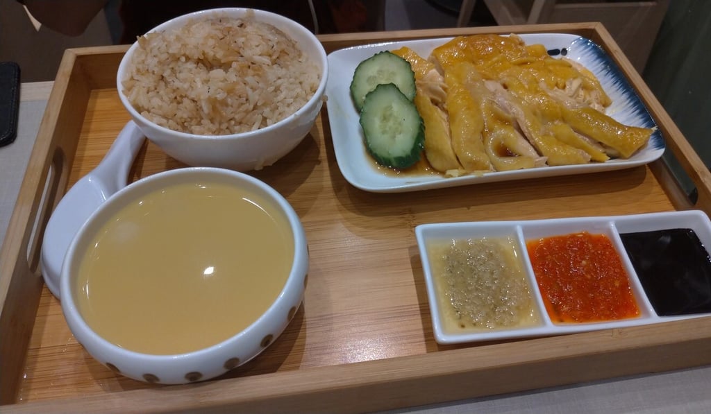 Boneless Hainanese chicken with seasoned rice and soup. Photo: Holly Chik