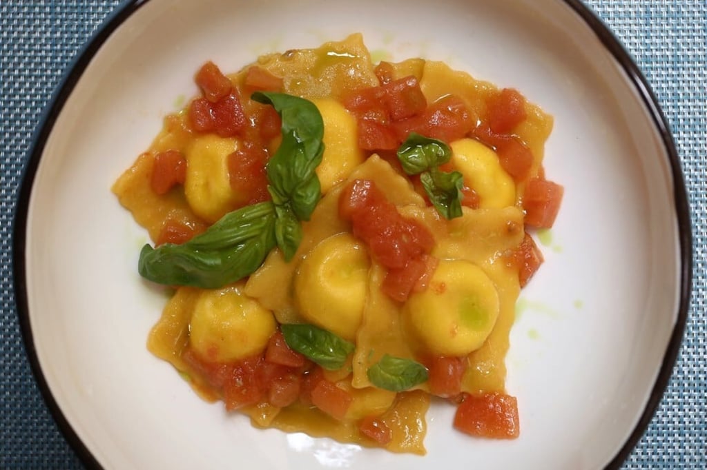 Home-made ravioli with ricotta, mascarpone, fresh Italian tomatoes and basil at LucAle. Photo: Jonathan Wong