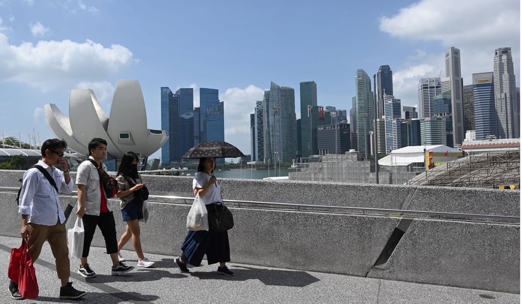 People walk along Marina Bay in Singapore. Photo: AFP