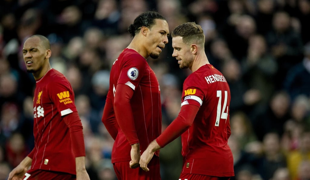 Liverpool captain Jordan Henderson celebrates with Virgil van Dijk after scoring against Southampton at Anfield. Photo: EPA