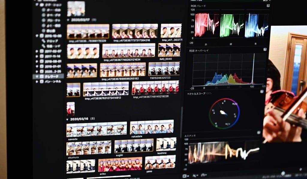 Trombonist Hisato Yamaguchi of the New Japan Philharmonic Orchestra edits videos of his fellow colleagues playing music at home. Photo: AFP Trombonist Hisato Yamaguchi of the New Japan Philharmonic Orchestra edits videos of his fellow colleagues playing music at home. Photo: AFP