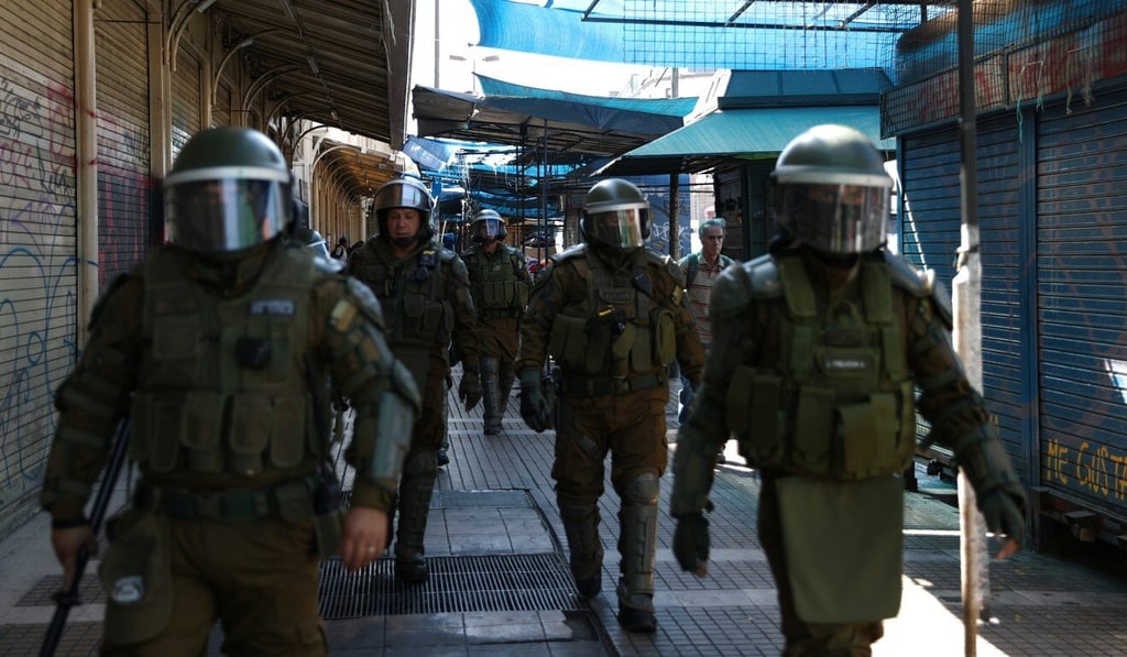 Riot police patrol a street in Santiago, Chile on April 3. Photo: Reuters Riot police patrol a street in Santiago, Chile on April 3. Photo: Reuters