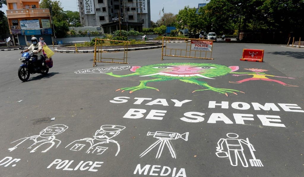 A motorist rides past an awareness graffiti reading 'Stay home be safe', during a government-imposed nationwide lockdown as a preventive measure against the coronavirus in Chennai. Photo: AFP A motorist rides past an awareness graffiti reading 'Stay home be safe', during a government-imposed nationwide lockdown as a preventive measure against the coronavirus in Chennai. Photo: AFP