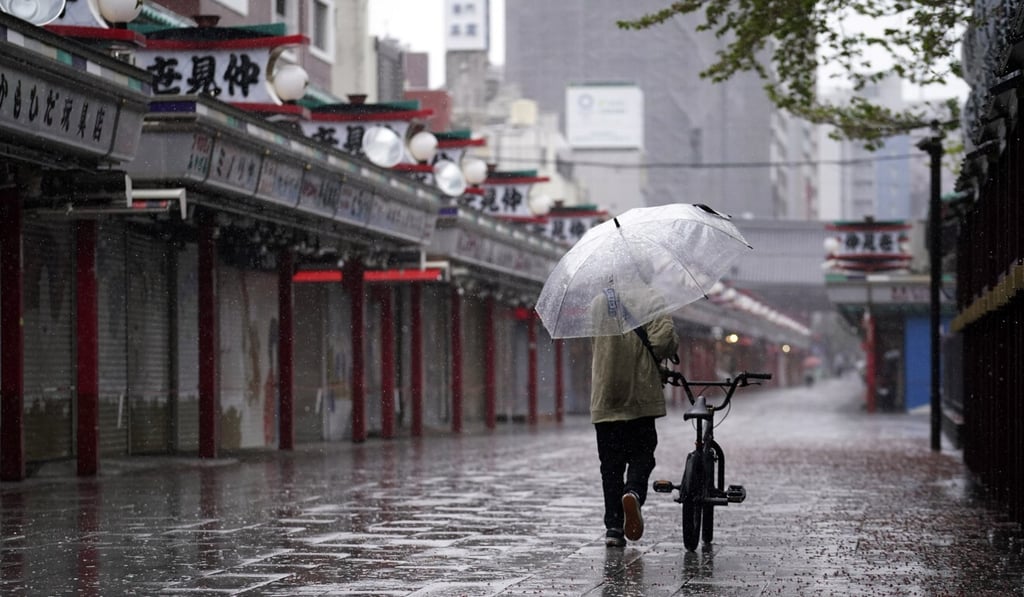 A man walks in the deserted Asakusa district of Tokyo on Monday. Photo: AP A man walks in the deserted Asakusa district of Tokyo on Monday. Photo: AP