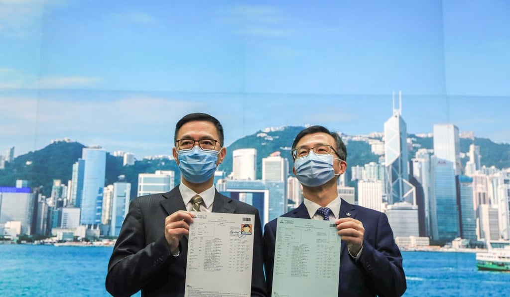 Kevin Yeung (left) and So Kwok-sang respectively display the new and old DSE candidate admission forms. Photo: May Tse Kevin Yeung (left) and So Kwok-sang respectively display the new and old DSE candidate admission forms. Photo: May Tse